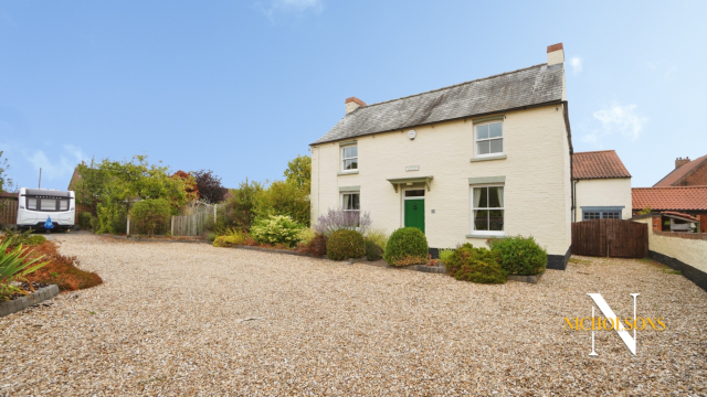 Charming Turn-of-the-Century Cottage with Extensive Grounds