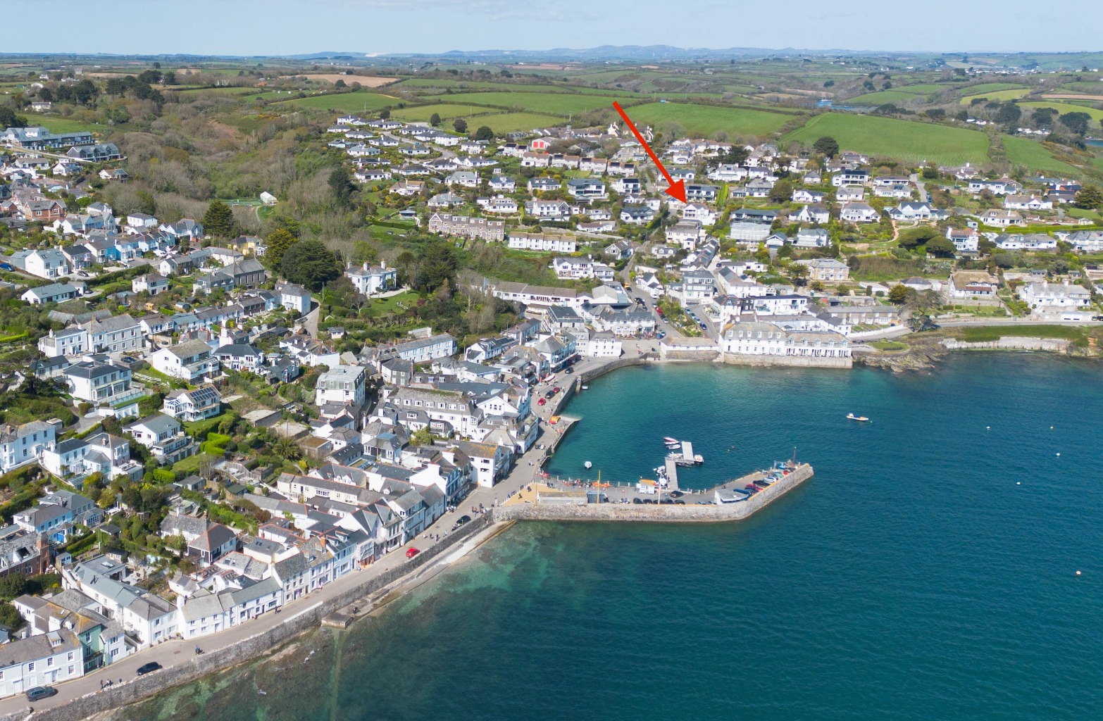 Sweeping coastal views, balconies, rare garage and parking, moments from the harbour.