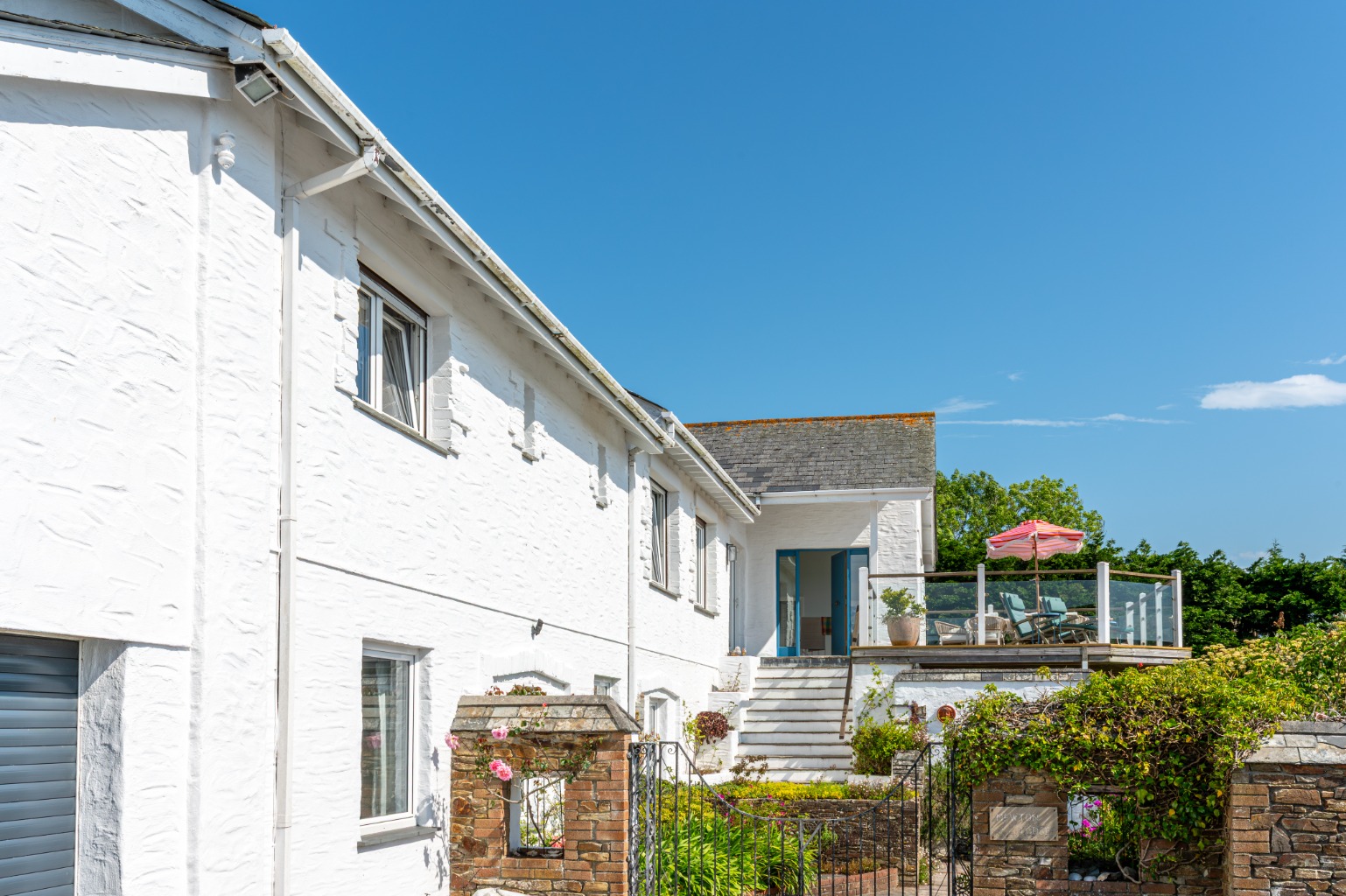 Substantial coastal home with privacy, balcony, gardens and double garage near St Mawes harbour