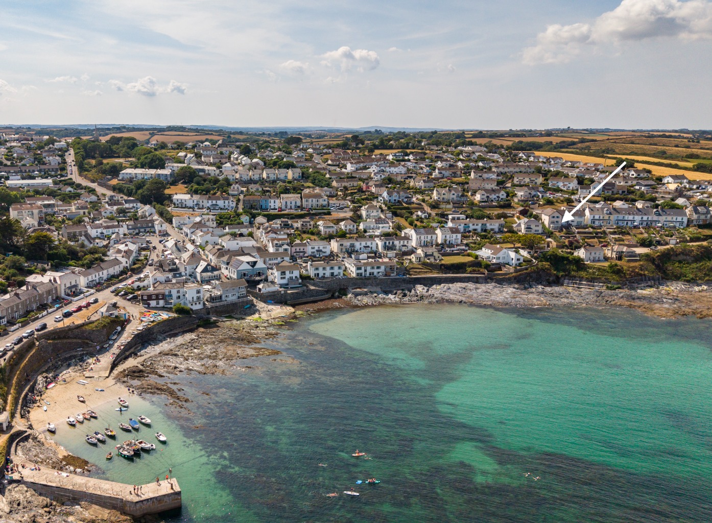 Ground floor coastal apartment with superb Gerrans Bay views, terrace, parking and detached garage.