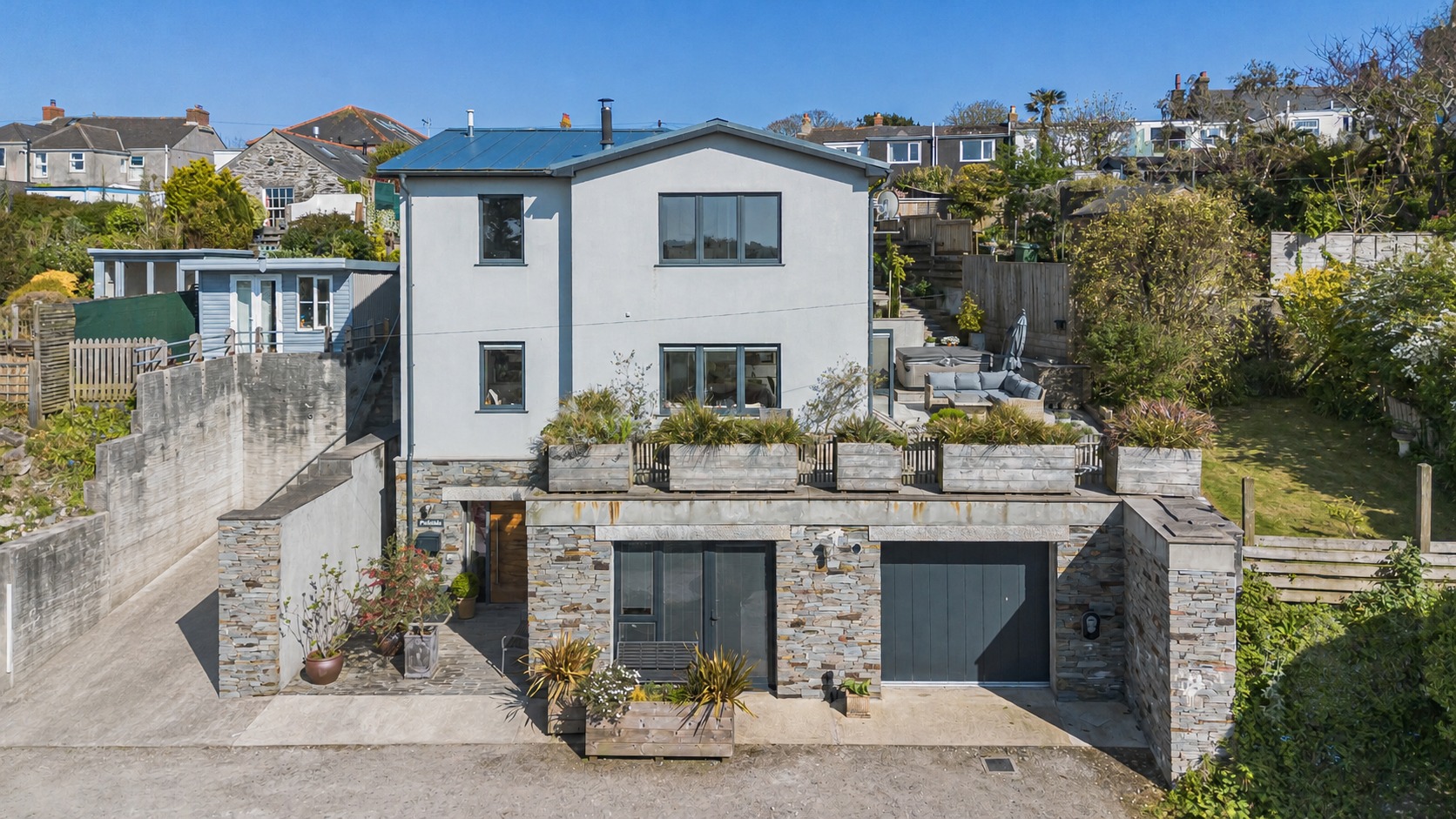 Contemporary eco home with annexe, lift and panoramic views in prime coastal village setting