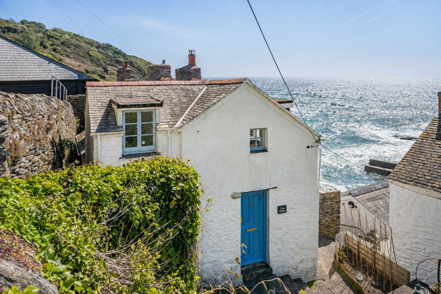 Harbour-side fisherman’s cottage with panoramic sea views and sun terrace in the heart of Portloe