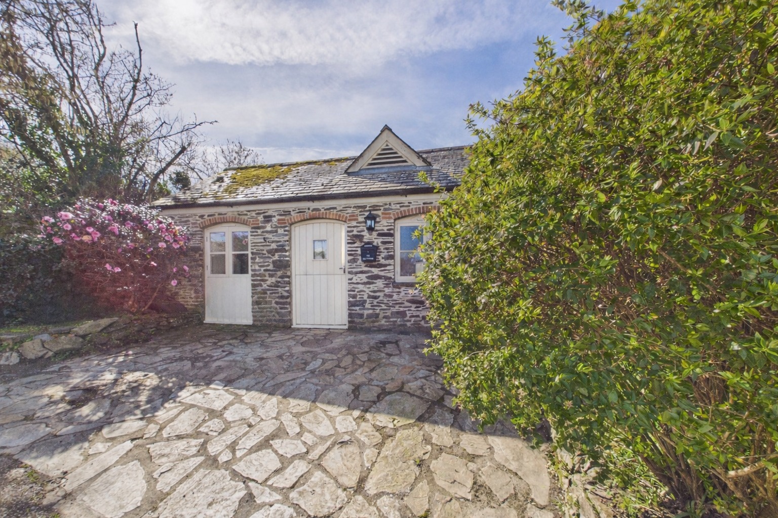 Charming detached former forge with courtyard garden, parking and character features.