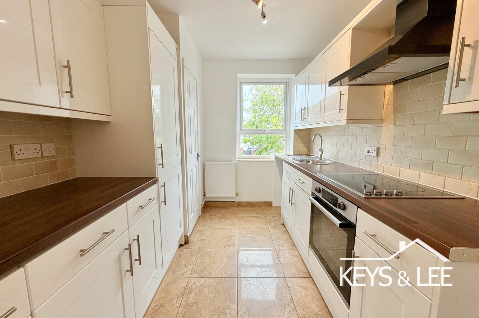 A modern 2 double bedroom first floor flat with front garden and allocated parking space. property first image