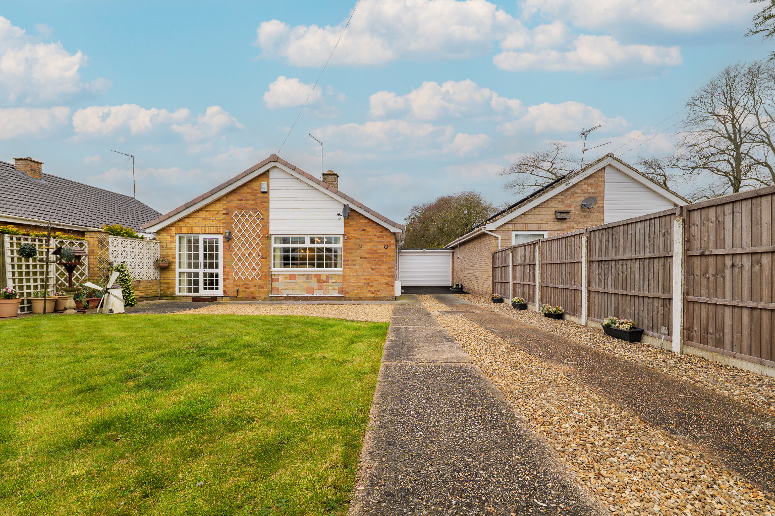 Spacious two bedroom detached bungalow with versatile living space.  Off Road Parking  with garage.