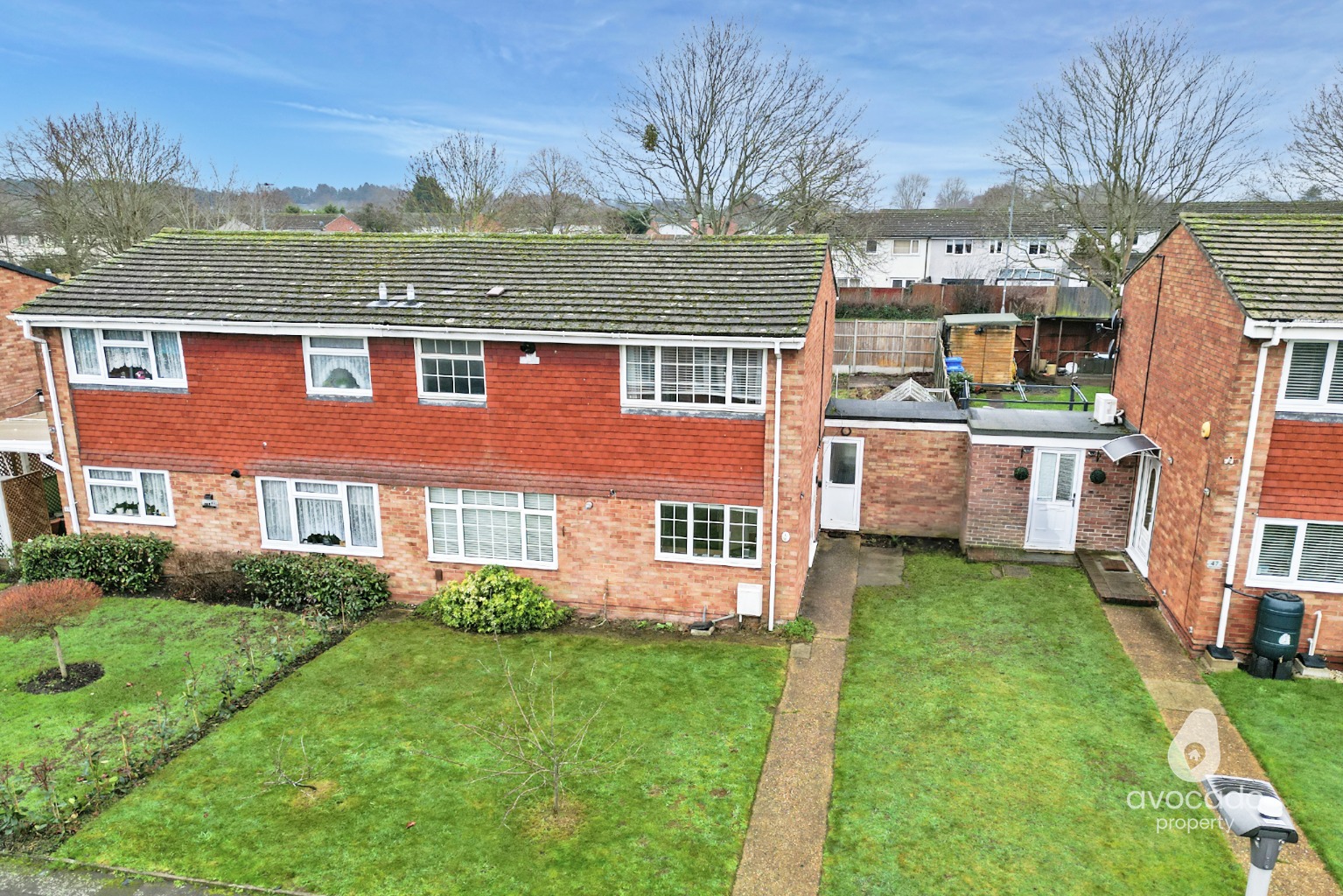A large three bedroom semi detached home with a garage in a block in need of some modernisation