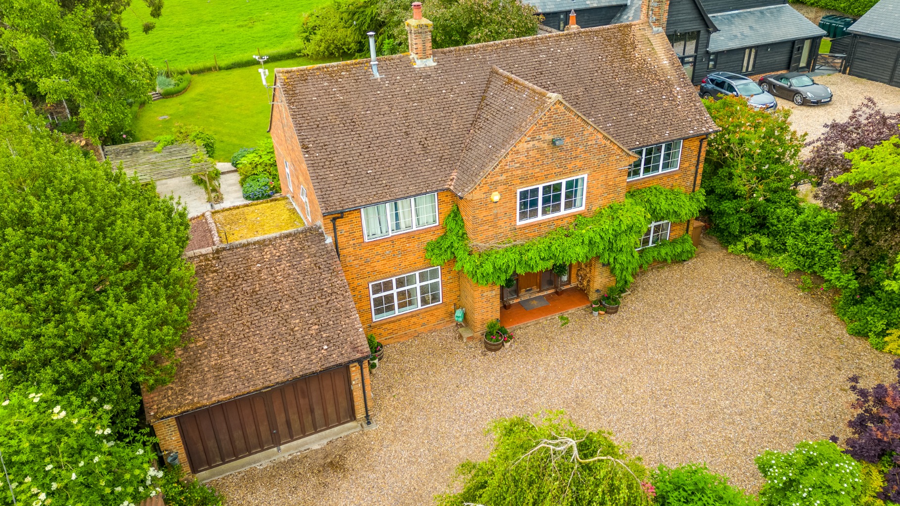 Four-Bedroom Home with Bespoke Kitchen and Countryside Views in Langley Village Four-Bedroom Home with Bespoke Kitchen and Countryside Views in Langley Village