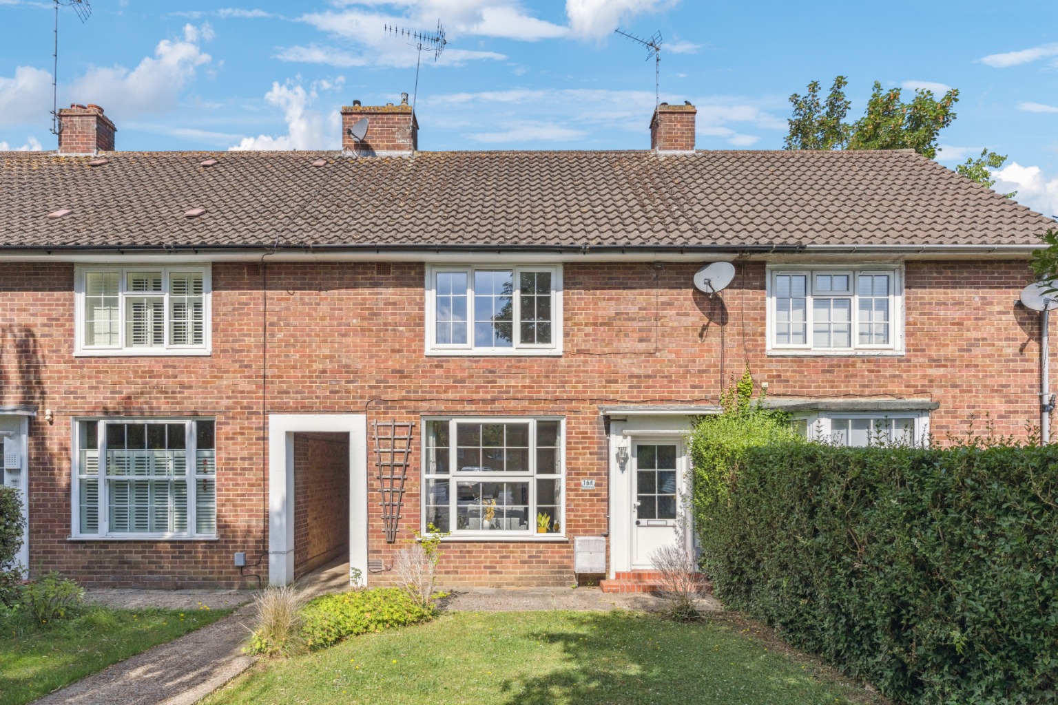 Mid-terrace home on Parkway offering off-street parking and West Side living