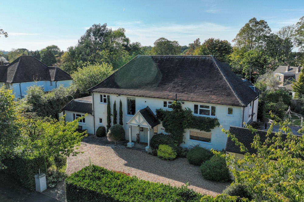 A handsome 5 bedroom country home with picture postcard gardens in a prime location.