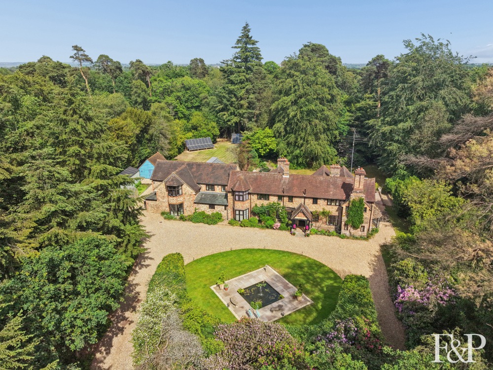 A distinguished 7000+ country residence set within approximately 3.5 acres of gardens and woodland.