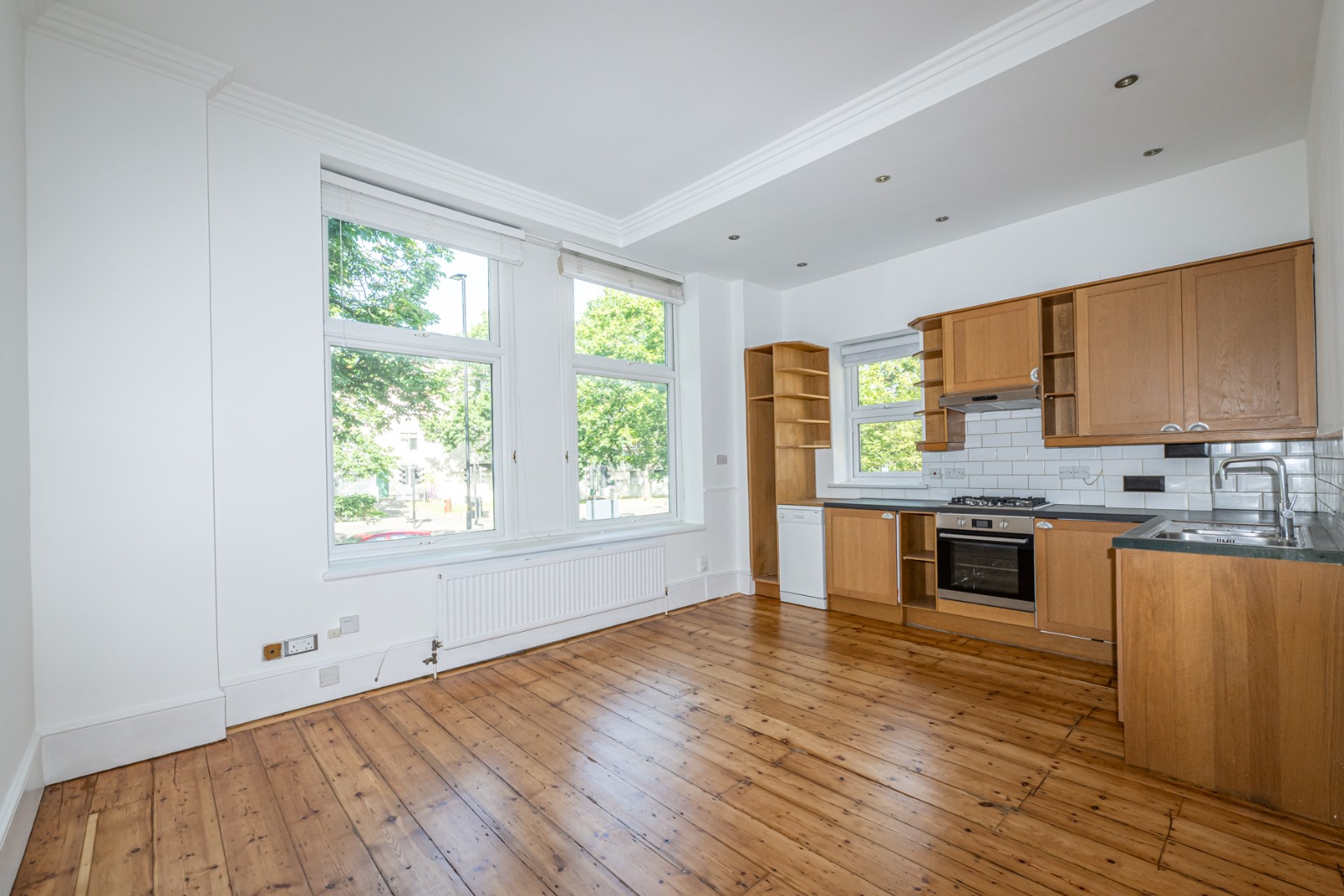 Redecorated raised ground floor one bedroom flat with a share of freehold and a huge communal garden