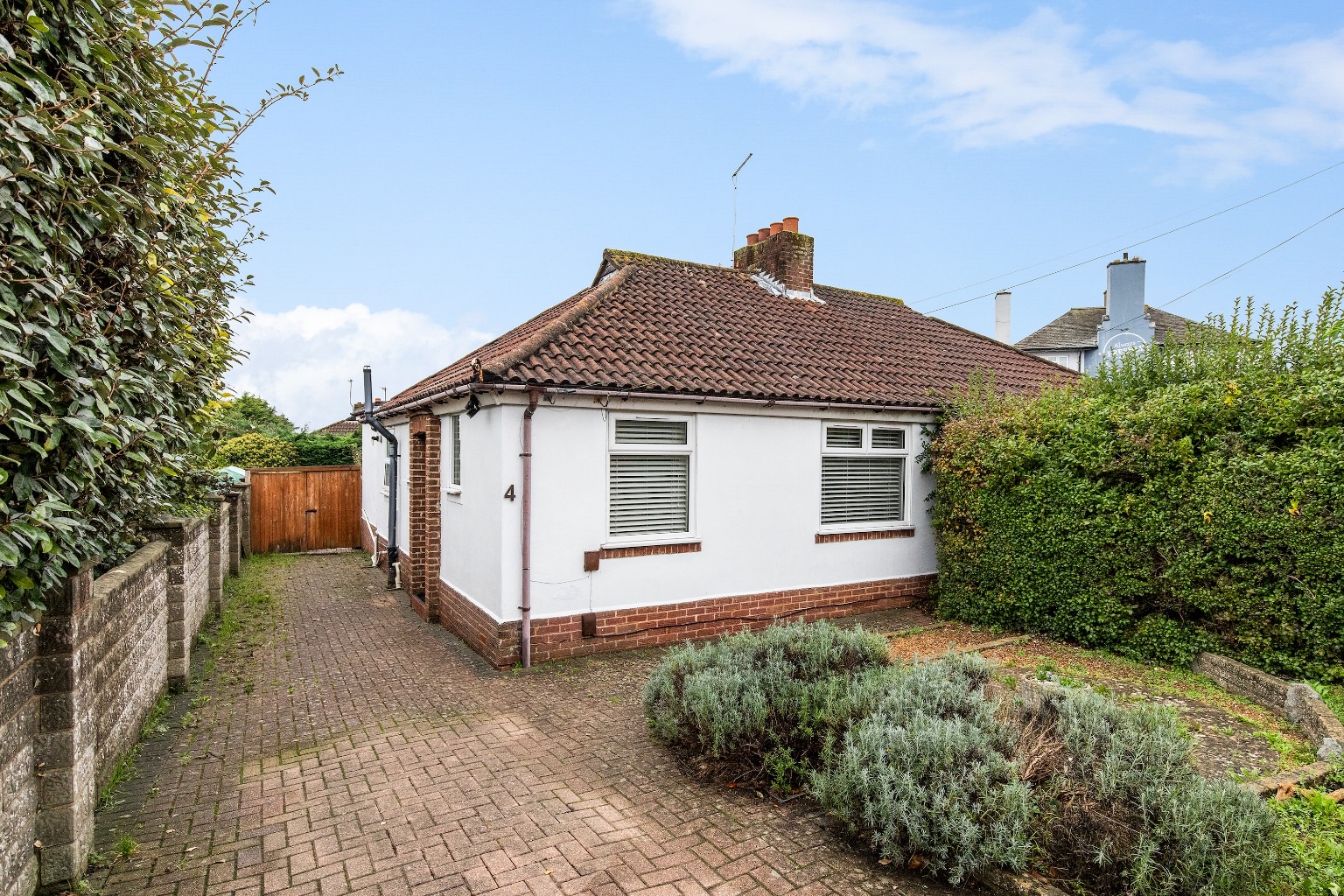 Charming Extended Bungalow with West-Facing Garden Near Holmbush Shopping Centre