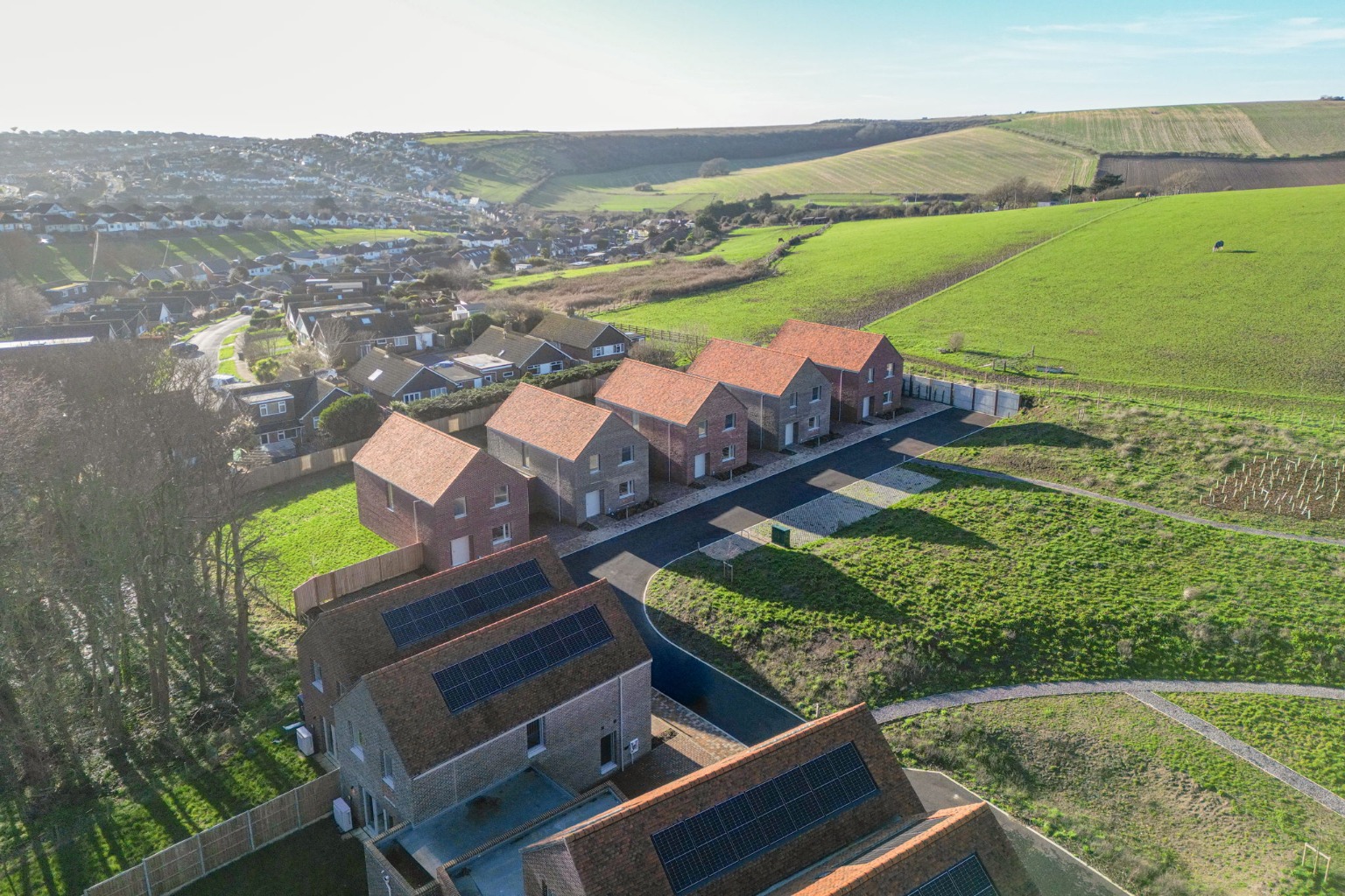 Detached 4 Bed Houses with Garages and south backing gardens on the Edge of the South Downs.