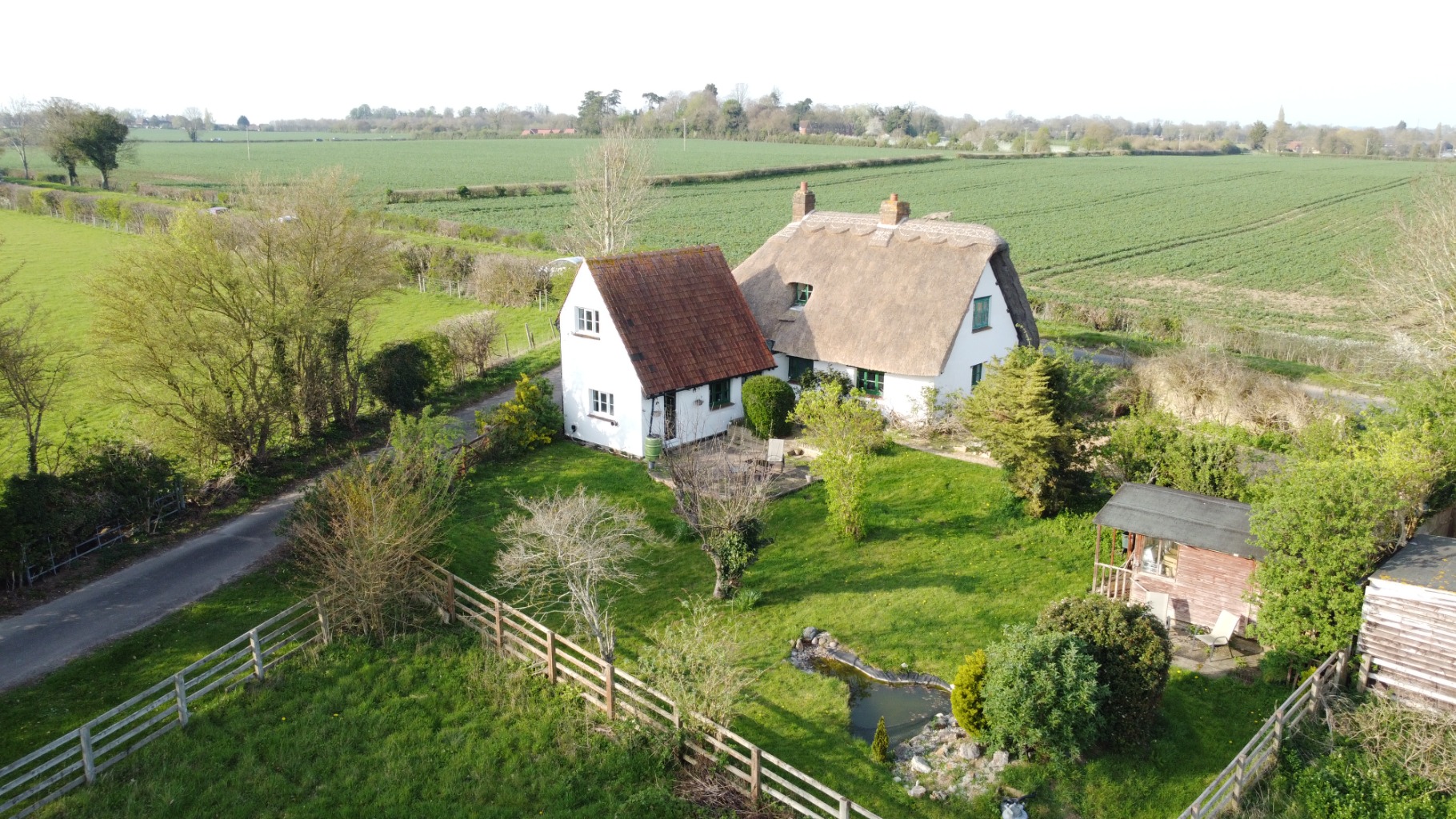 A charming Grade II listed, 18th-century part thatched four bedroom cottage.