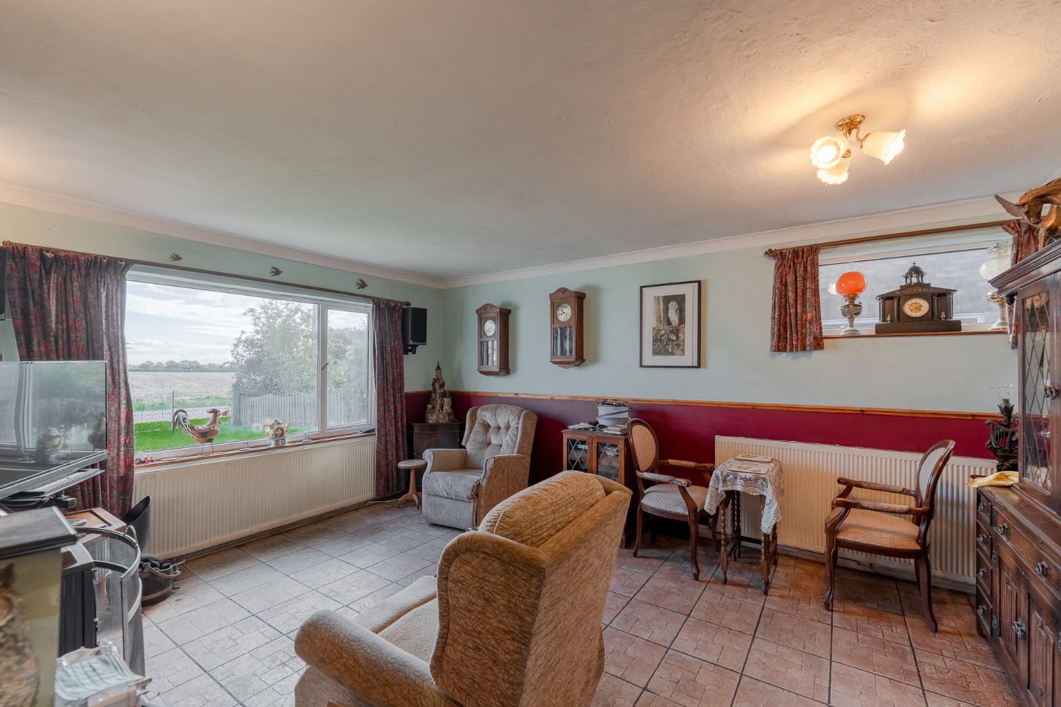 Detached chalet bungalow offering versatile accommodation, over looking fields to front and rear Property image 7
