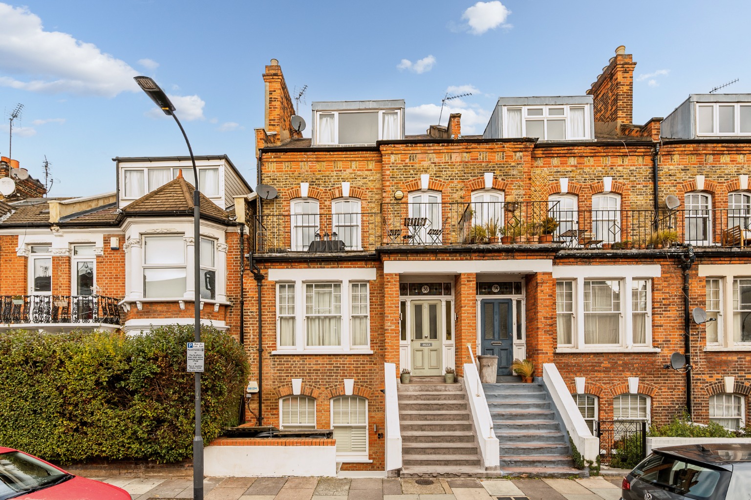 Elegant Split-Level Victorian Apartment with Private Balcony Moments from Barons Court.