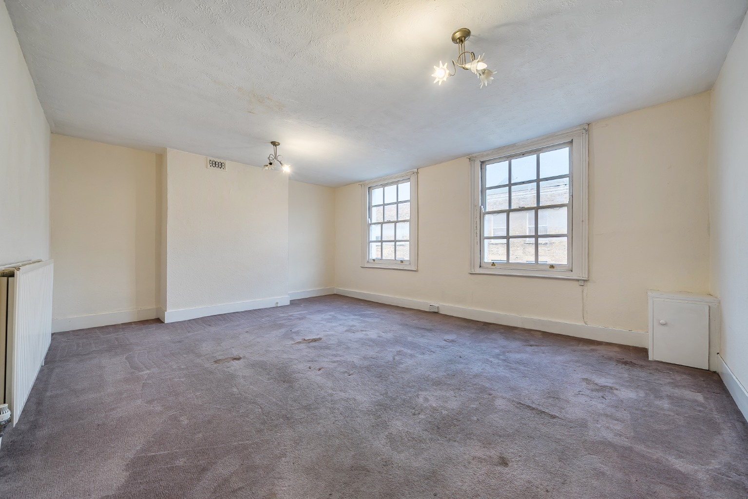 Top Floor Two-Bedroom Apartment with Refresh Potential in Vibrant Deptford