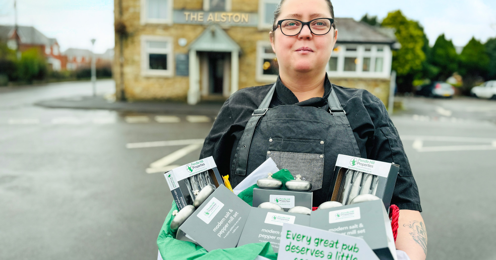 Pendle Hill Properties delivers special welcome gift to new Alston Arms management in Longridge