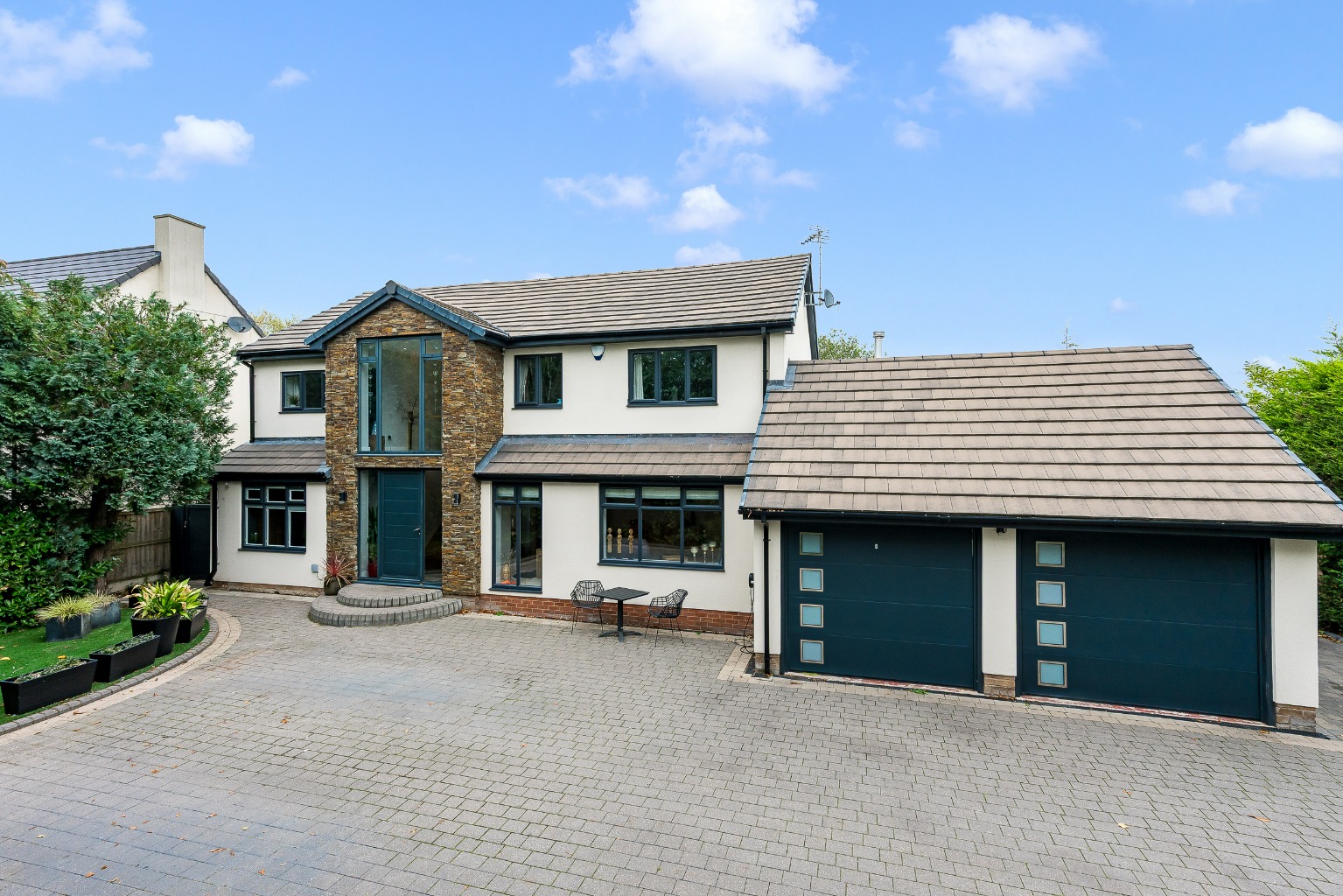 A five bedroom  detached home with gated entrance and swimming pool located in Culcheth