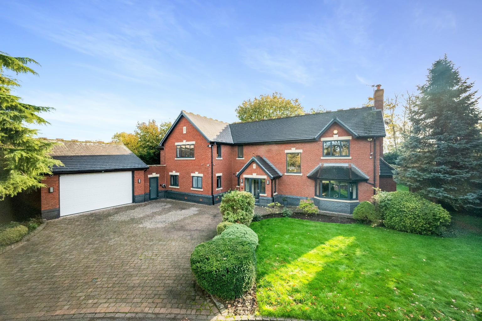 An exceptional five  bedroom executive detached home located in a gated development in Culcheth.