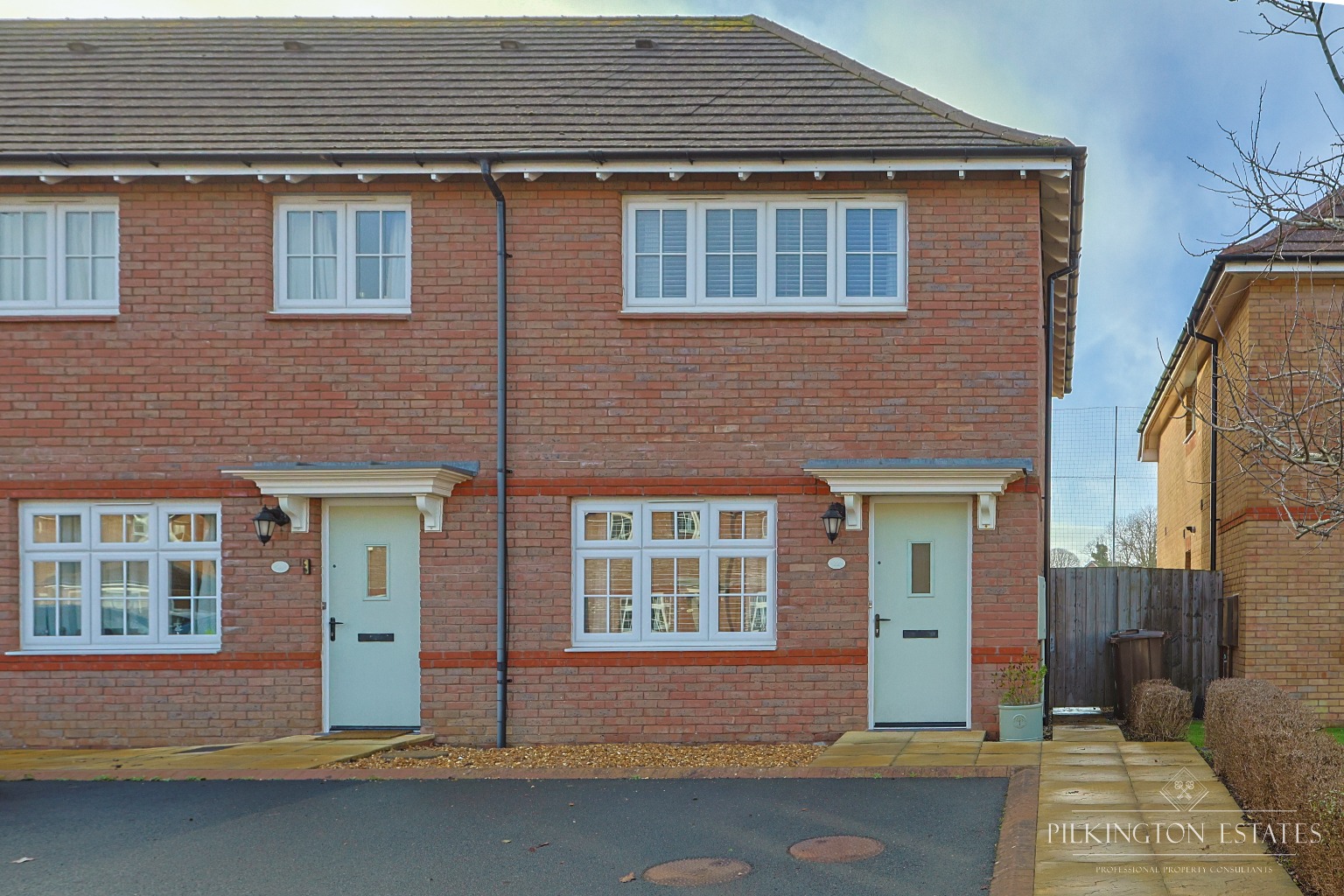 Immaculate Two Bedroom End of Terrace Home with Summer House and Parking