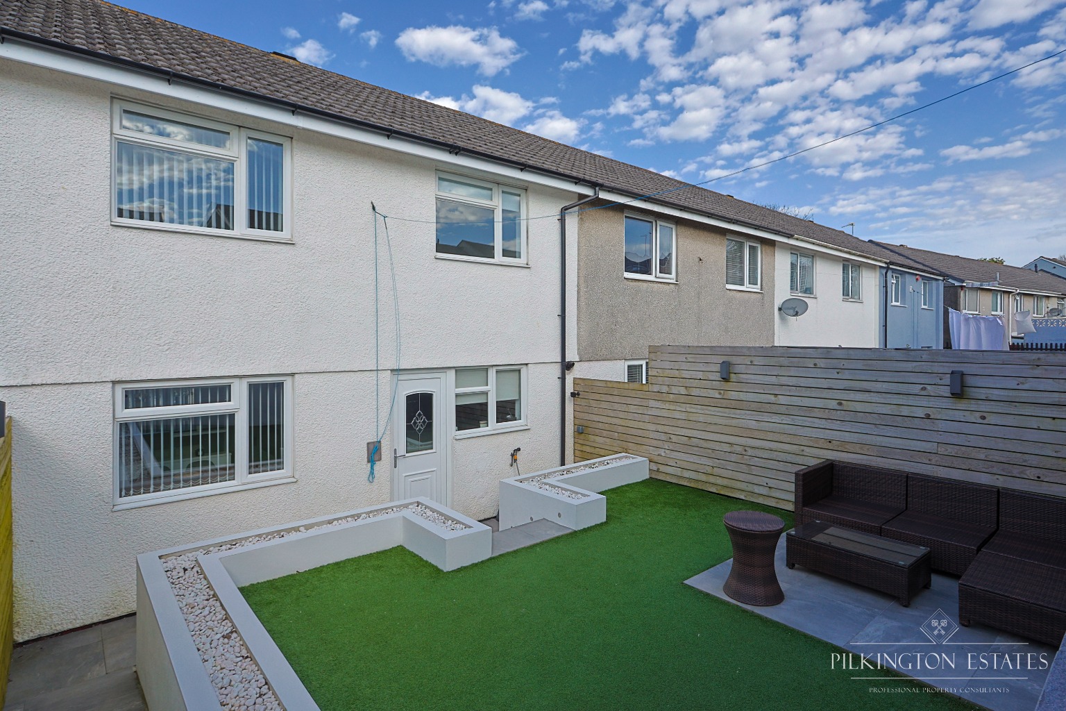 Stylish 3-bed PL5 terrace with open-plan living, landscaped garden, garage and parking. EPC D Property image 1