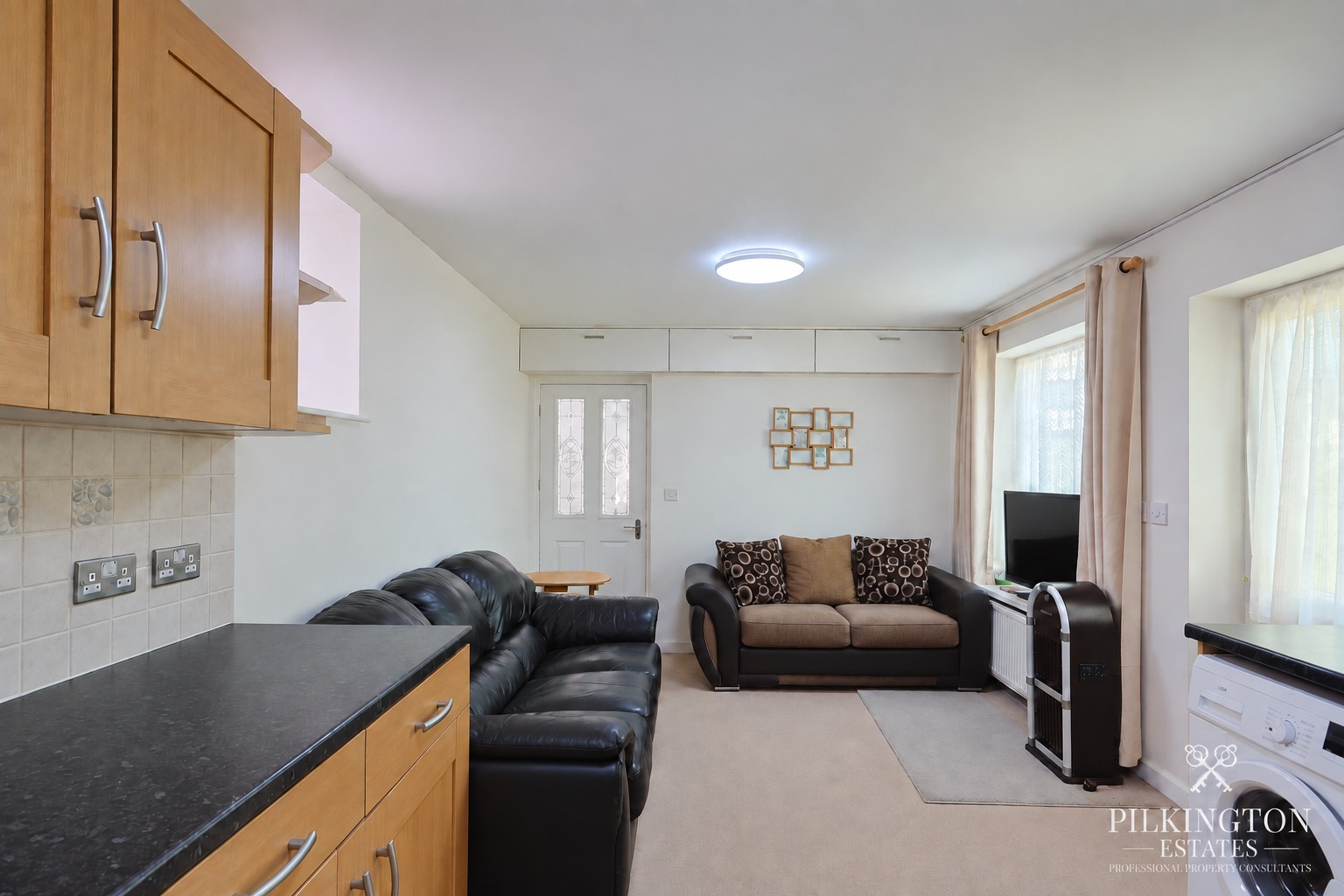 Spacious ground floor home with flexible living space, kitchen/diner, bedroom, bathroom and storage. Property image 3