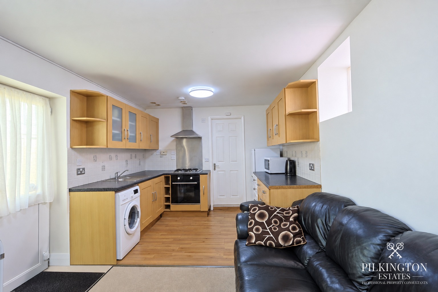 Spacious ground floor home with flexible living space, kitchen/diner, bedroom, bathroom and storage. Property image 2