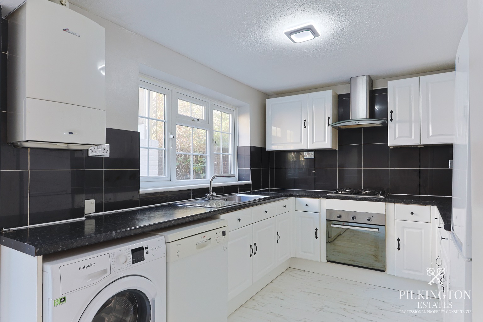 Spacious Three-Bedroom Home Over Three Floors with Garage, Driveway & Tiered Garden Property image 3