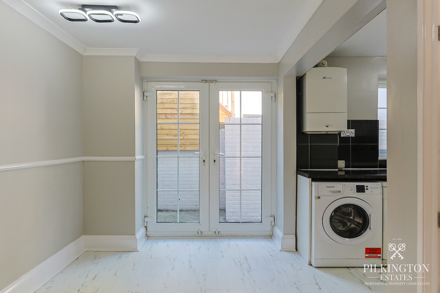 Spacious Three-Bedroom Home Over Three Floors with Garage, Driveway & Tiered Garden Property image 4