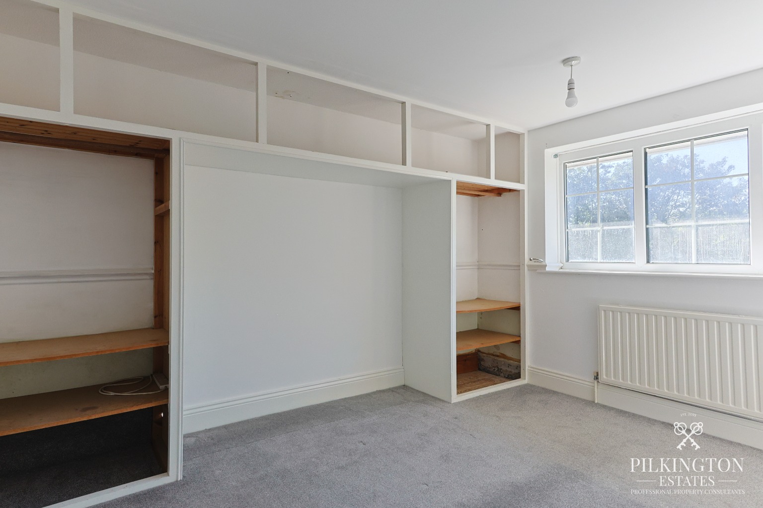 Spacious Three-Bedroom Home Over Three Floors with Garage, Driveway & Tiered Garden Property image 5