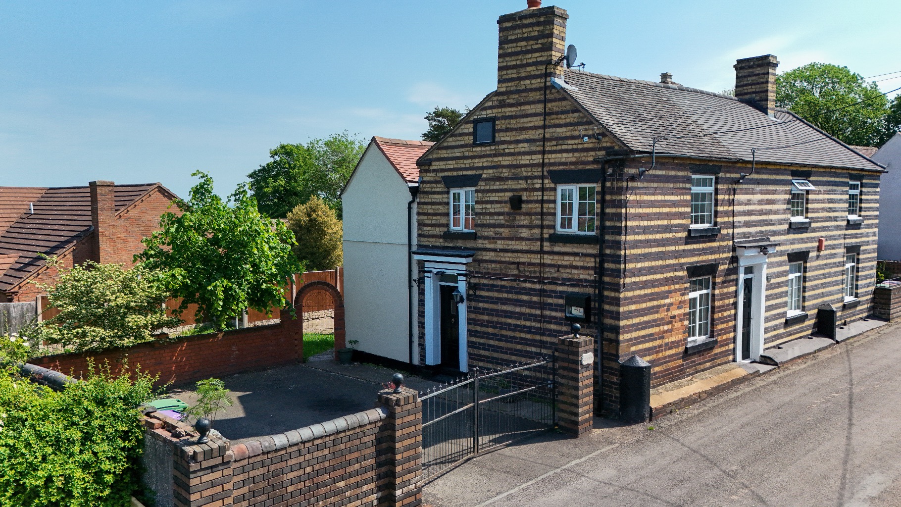 Charming 3-Bedroom House with Ample Parking and Private Garden on Main Road, Telford