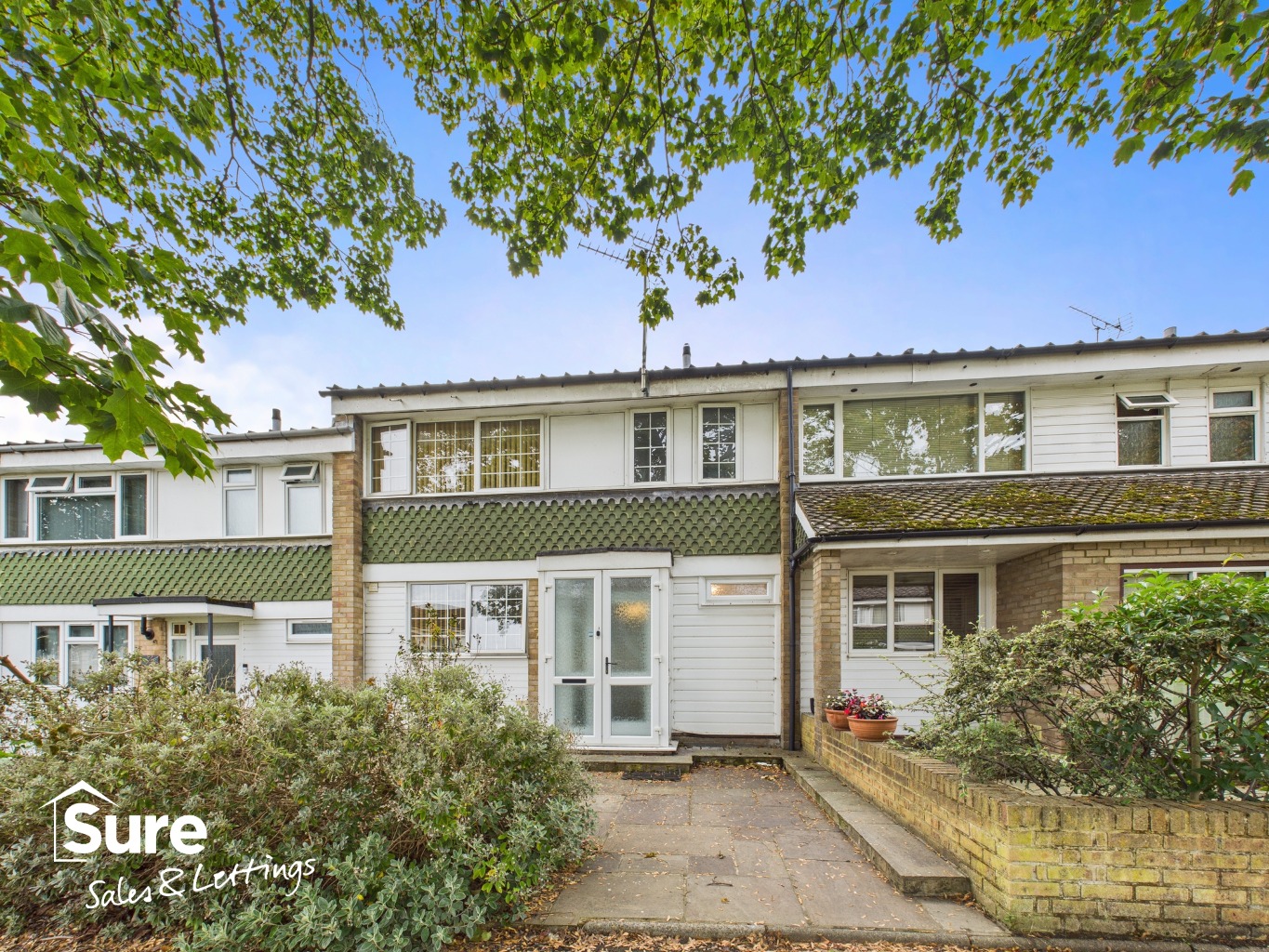 Charming Three-Bedroom Terraced House with Garage and Garden in Hertfordshire