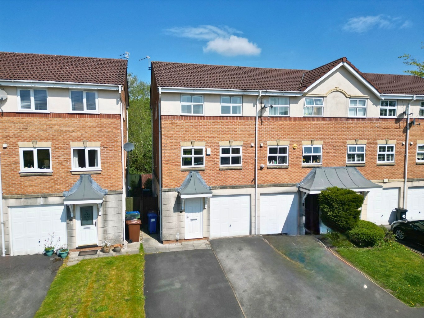 Peaceful three-bed end townhouse with pond views, garden, driveway, garage, and spacious living.
