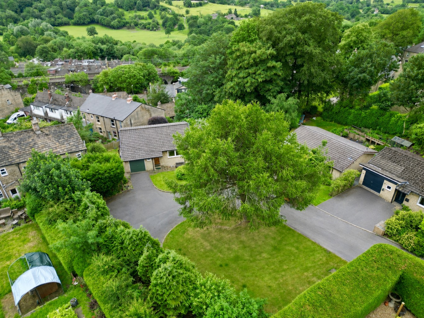 Offered to the market with no onward chain, this detached two-bedroom home