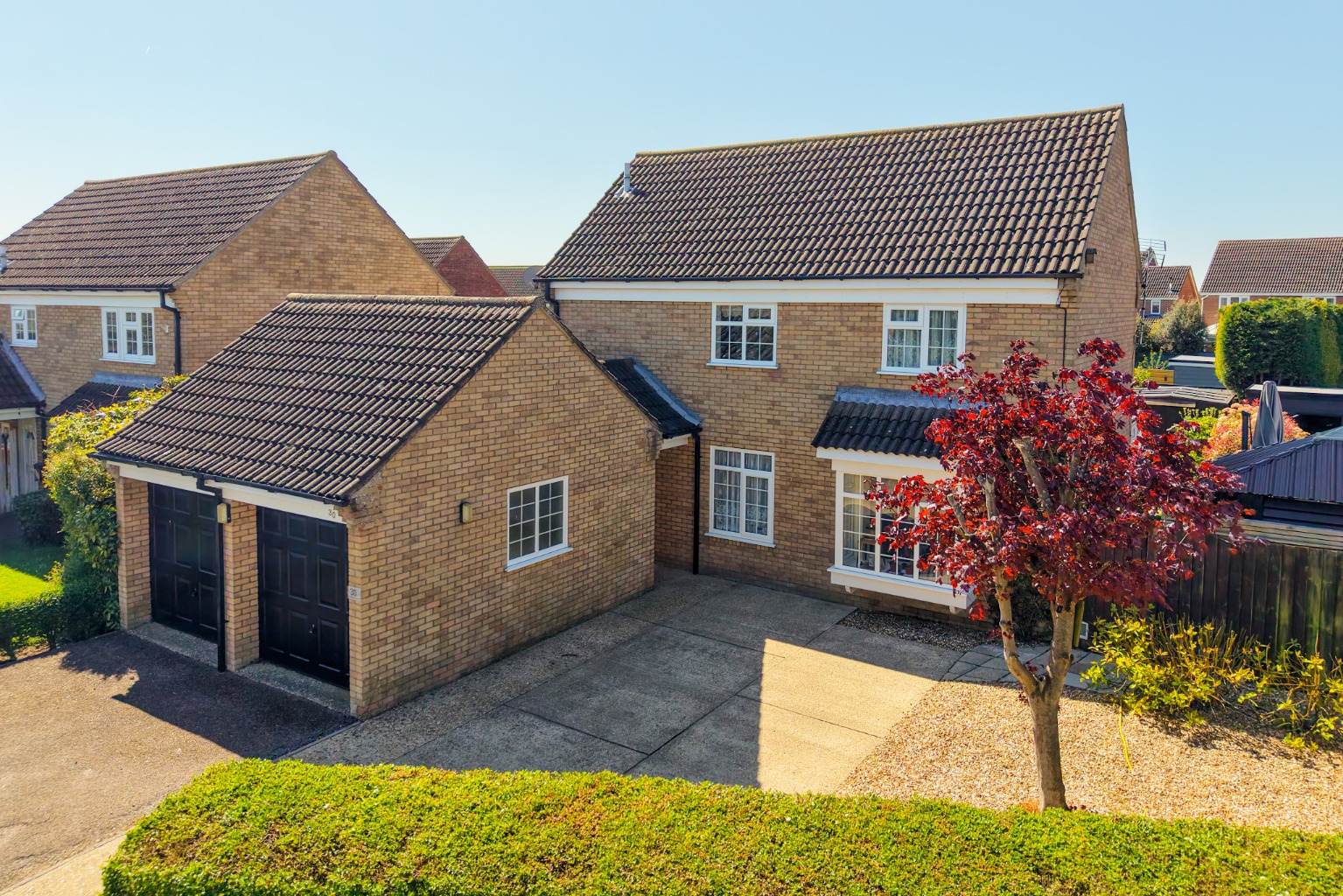 Four bedroom detached house with double garage and south facing garden in cul-de-sac of  four homes