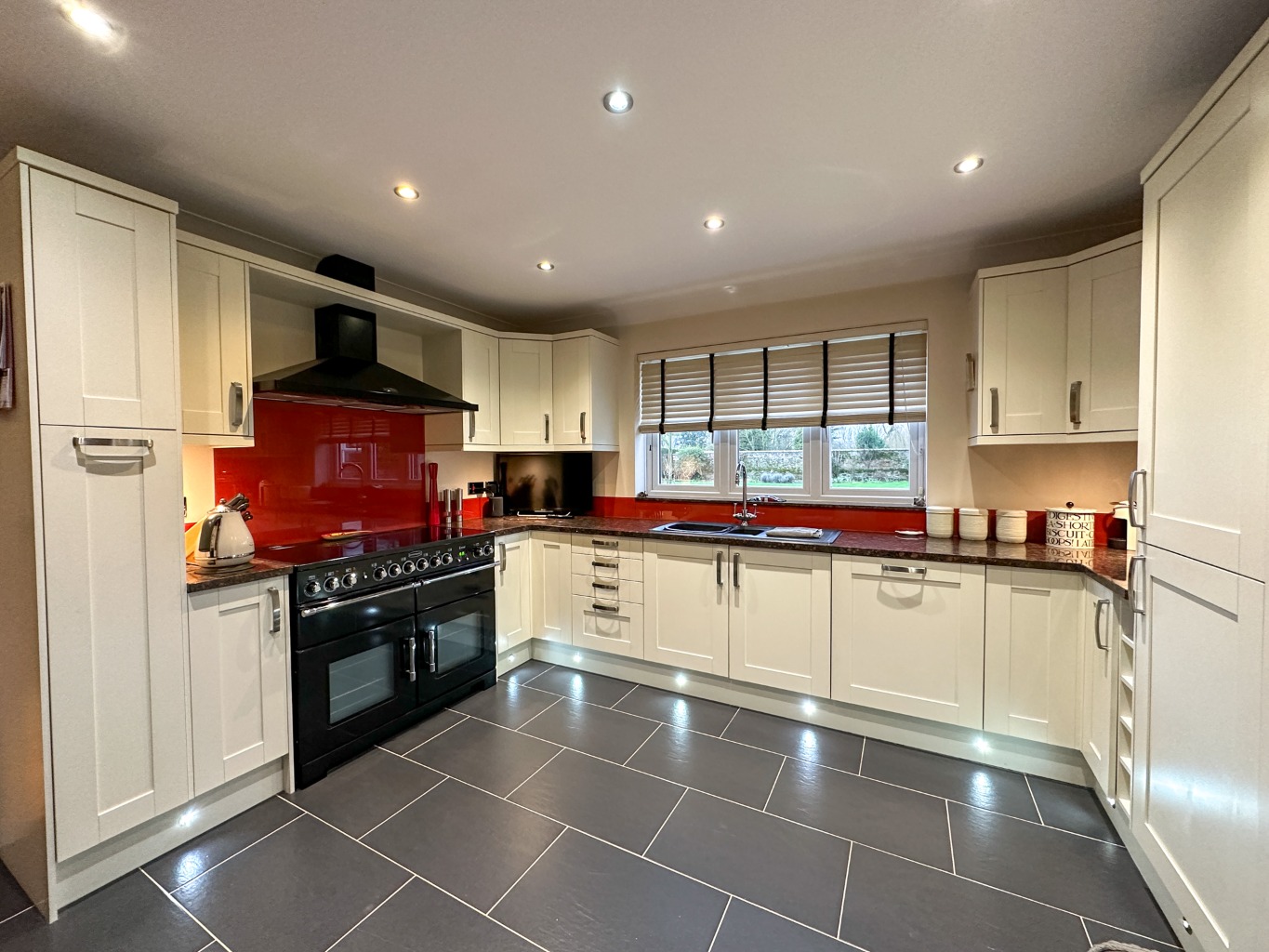 Presenting an executive family home set on a generous half-acre plot, directly overlooking the green property fourth image