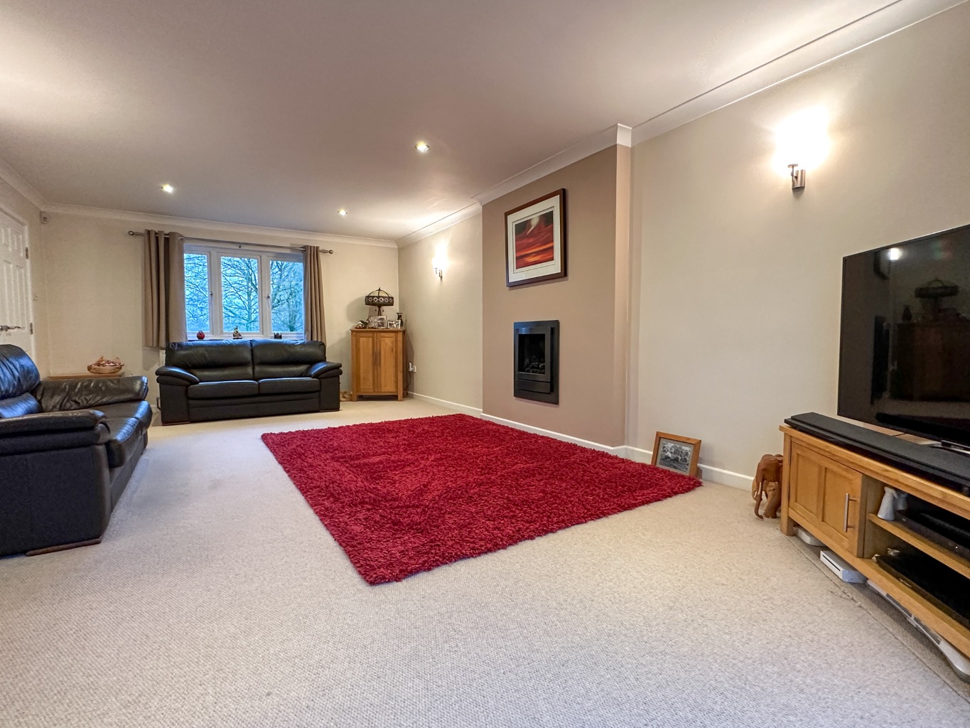Presenting an executive family home set on a generous half-acre plot, directly overlooking the green property second image