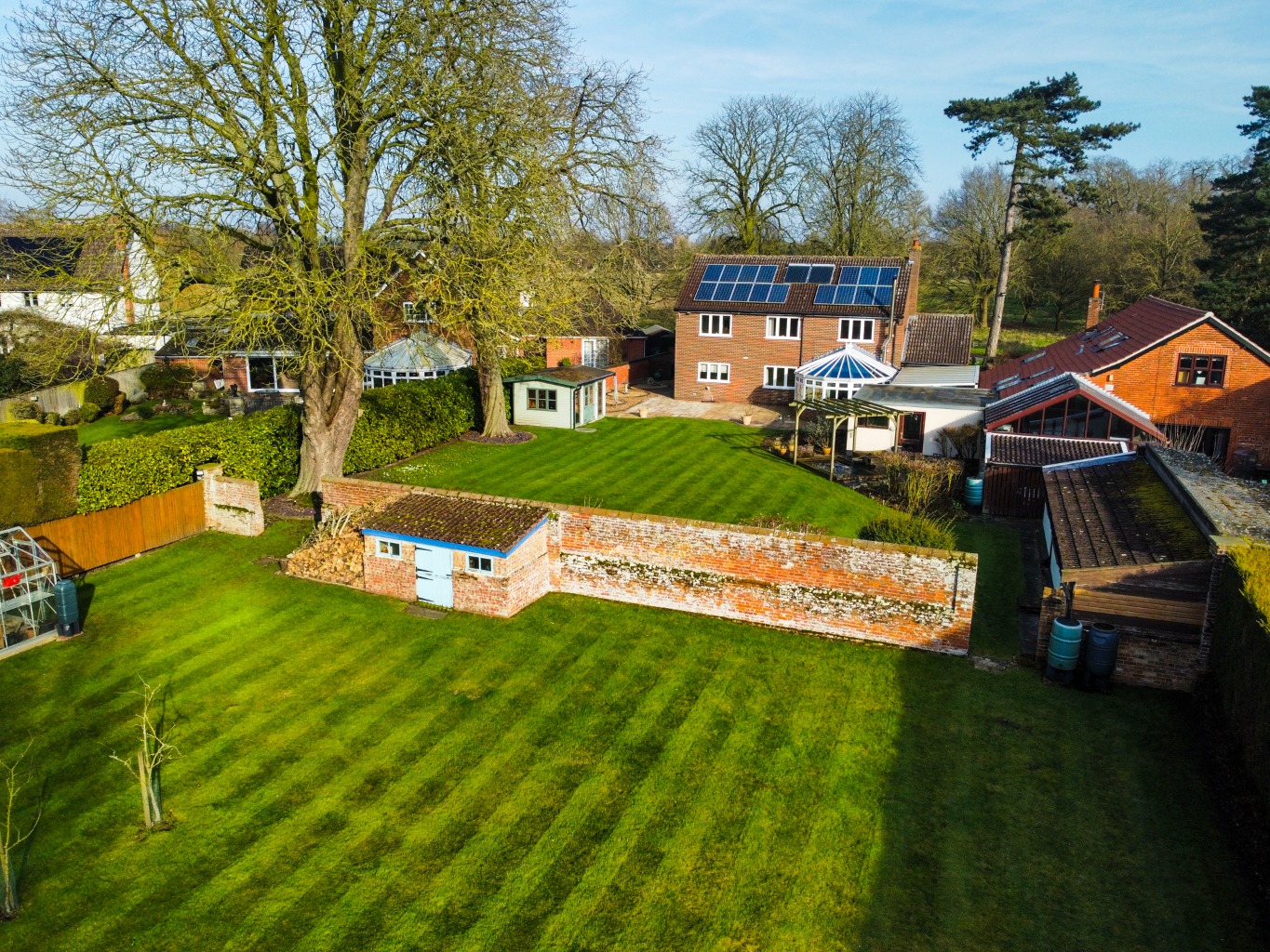 Presenting an executive family home set on a generous half-acre plot, directly overlooking the green property third image