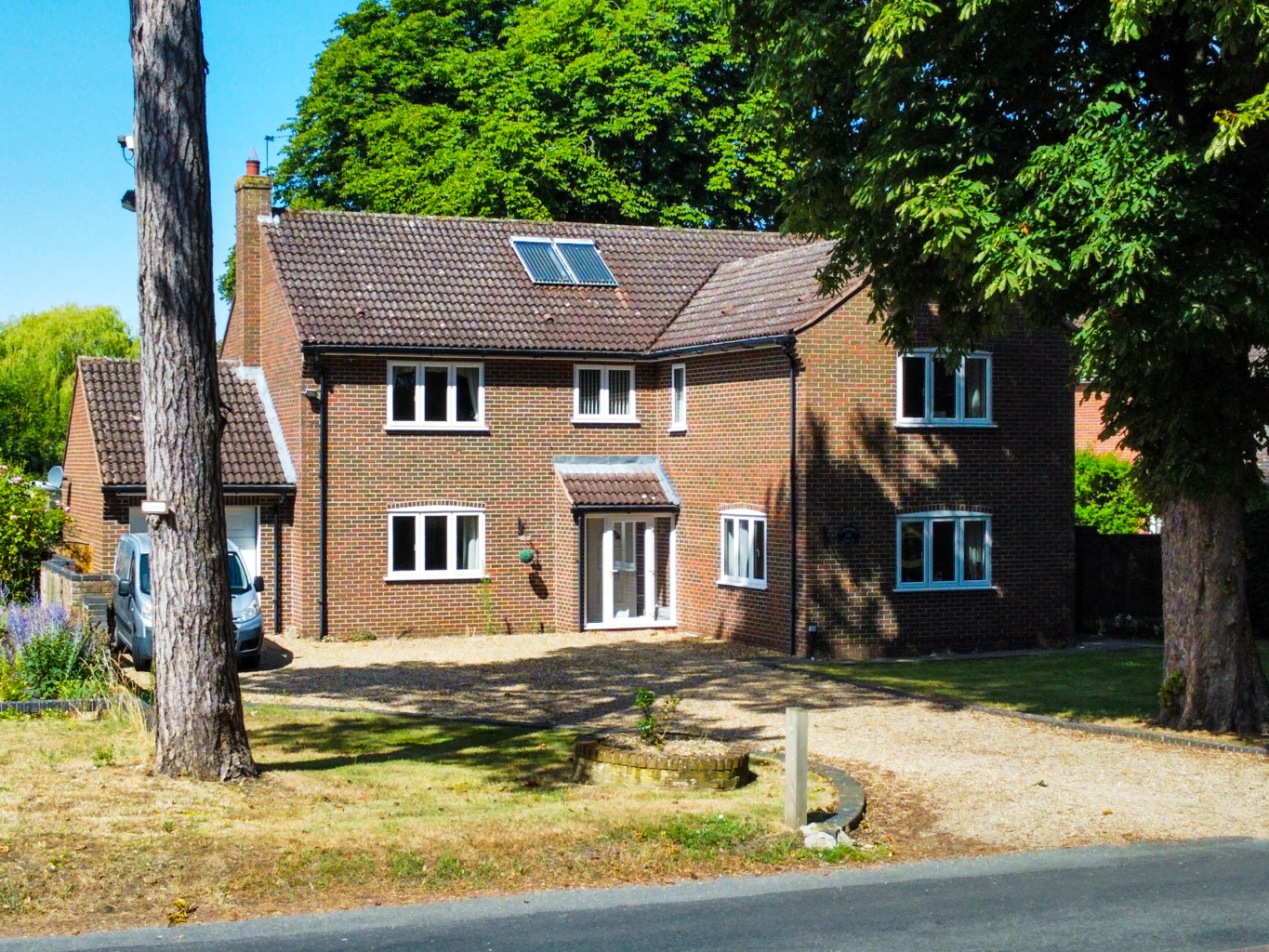 Presenting an executive family home set on a generous half-acre plot, directly overlooking the green property first image